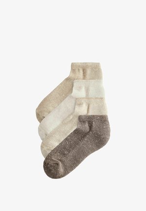 Vier Paar Socken in verschiedenen Beigetönen und Braun, mit einer gesprenkelten Textur und gerippten Bündchen, hergestellt aus weichem Material.