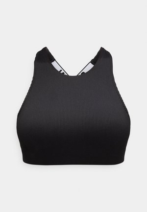Svart ribbestrikket sports-BH med høy hals og elastiske stropper som krysser på ryggen, vist mot en ensfarget bakgrunn.