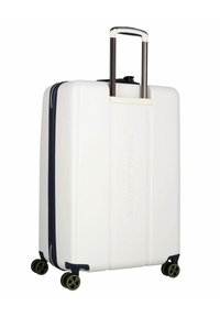 Valigia rigida bianca con finitura testurizzata, manico estensibile, dettagli blu e quattro ruote multidirezionali. Marchio Delsey Paris visibile.