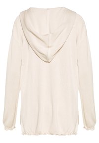 Jasno beżowy sweter z kapturem o ribbowanym wzorze, długimi rękawami i zmarszczonym dołem. Posiada prosty, minimalistyczny design.