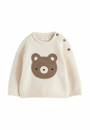 Crèmekleurige gebreide babytrui met een bruin teddybeertje op de voorkant en drie houten knopen op de linkerschouder.