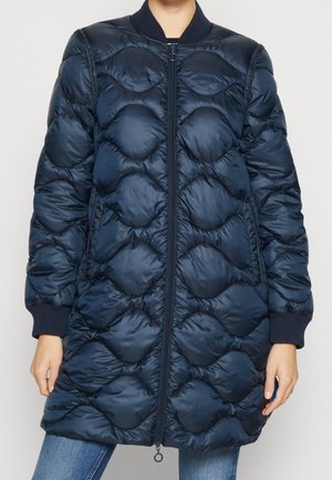 Navy blue puffer coat with a quilted, rounded design, featuring a zip front and ribbed cuffs. Made from shiny, water-resistant material.