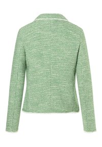 Zelený tvídový kabát vyrobený z texturované látky, s klopovým límcem, dlouhými rukávy a mírně padnoucím střihem.