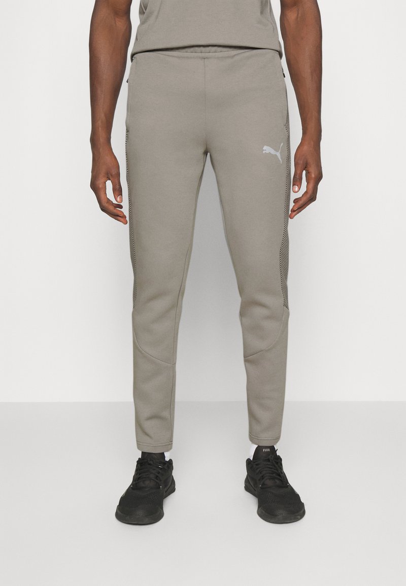 Puma EVOSTRIPE Tracksuit bottoms concrete gray/grey Zalando.co.uk