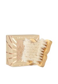 Bamboo szczoteczka z gęstymi, miękkimi włosiem w falistym wzorze. Zapakowana w złote pudełko z geometrycznymi wzorami i ziemistymi tonami.