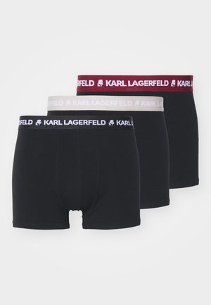 Três pares de boxers pretos com cinturas elásticas. As bandas estão rotuladas com "KARL LAGERFELD" em branco, cinza e bordô.