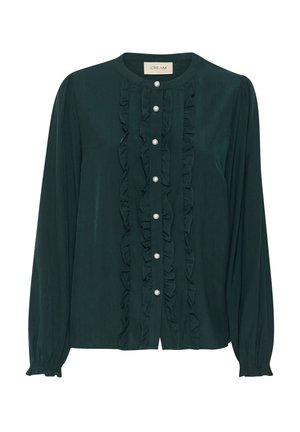 Dark green blouse made of soft fabric, featuring front ruffles and pearl buttons. It has long sleeves and a round neckline.