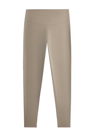 Leggings beiges taille haute, longueur totale, avec une texture lisse et extensible et un détail de couture en forme de V à la taille.