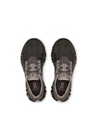 Dark gray running shoes with a textured mesh upper, reinforced heel, and flexible sole. Features gray laces and logo on the tongue.