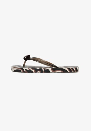 Sandalo infradito flat con suola effetto stampa animalier nera, bianca e marrone e cinturino infradito marrone traslucido con dettaglio a fiocco.
