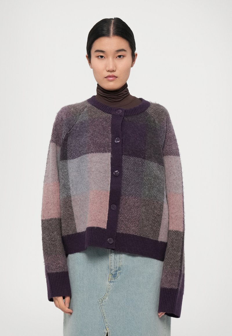 Knit cardigan with a purple, grey, and pink checkered pattern, featuring a round neck, button closure, and ribbed cuffs and hem.