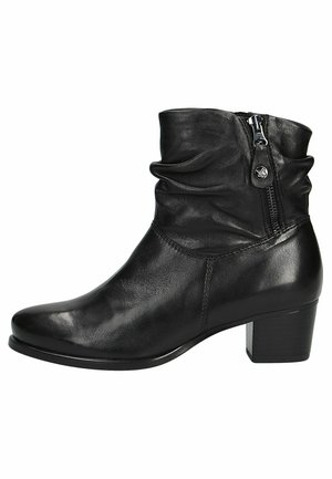 Black leather ankle boot with a slouchy design, zip closure on the side, and a square high heel. Smooth texture with minimal detailing.
