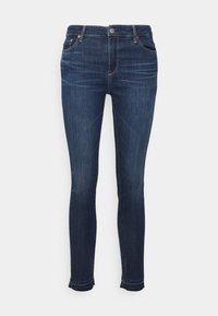 Smal passform mörkblå denimjeans med subtil blekning, femficksdesign och fransade fållar för en avslappnad look. Justerbar midja med metallhardware.