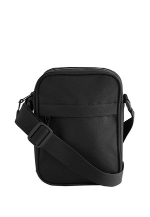 Bolso bandolera negro compacto con correa ajustable, compartimento principal con cremallera y bolsillo frontal, mostrado sobre fondo blanco.