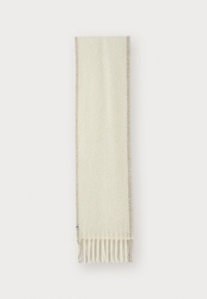 Krämfärgad scarf som är gjord av mjukt material, med en beige kant och fransade ändar. Texturen verkar slät och varm.