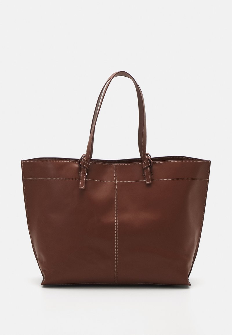 Brown leather tote bag with double handles, features contrast stitching and a spacious design, suitable for everyday use.