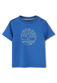 Blauwe katoenen t-shirt met korte mouwen, voorzien van een groene boomafbeelding op de voorkant en twee drukknoopjes op de schouder.