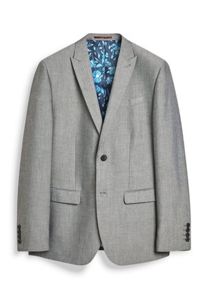 Blazer grigio su misura con fodera interna floreale blu, due tasche frontali, chiusura a un bottone e polsini con tre bottoni. Texture morbida.