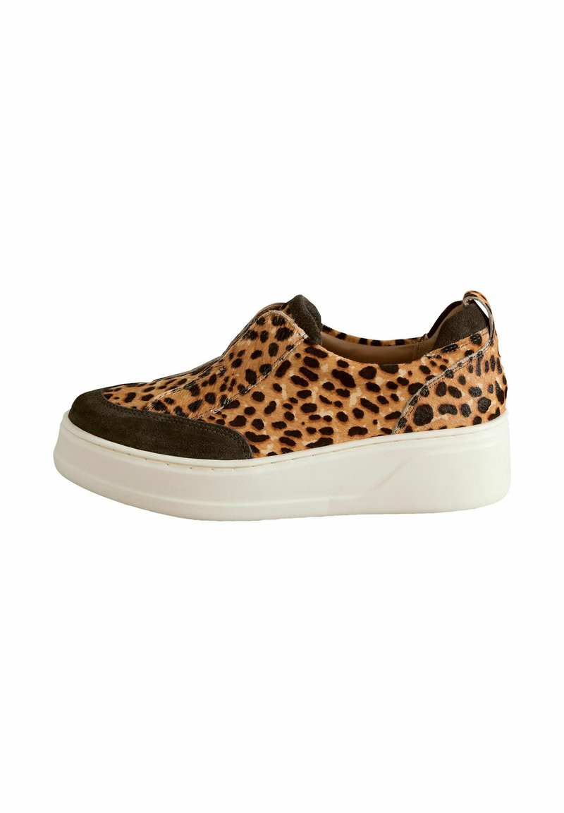Slip-on sneaker with a tan leopard print upper, dark green suede accents, and a chunky white rubber sole. Features a smooth texture.