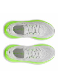 White athletic shoes with a textured mesh upper and bright green accents. Features include a lace-up design and a contrasting sole.