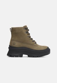 Olive green leather ankle boots with a black rubber sole, lace-up design, and a pull tab at the back for easy wear.