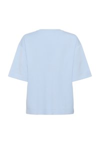 Světle modré bavlněné tričko s krátkým rukávem, kulatým výstřihem a oversized střih. Hladká textura a jednoduchý, jednobarevný design.