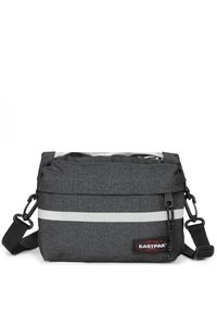 Borsa a tracolla grigia in tessuto con chiusura a patta, dotata di una tasca trasparente frontale, dettaglio a striscia argentata e tracolla regolabile. Logo Eastpak presente.