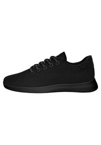 Black sneaker with a textured mesh upper, round laces, and a cushioned sole. Smooth silhouette with a subtle heel accent.