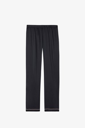 Pantalon noir avec une taille élastique, caractérisé par une coupe ample et une bordure de couleur claire à l'ourlet, confectionné dans un tissu lisse.