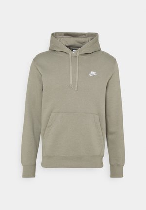 Sweat à capuche Nike vert olive clair avec poche avant, capuche avec cordon et petit logo Nike blanc sur la poitrine.