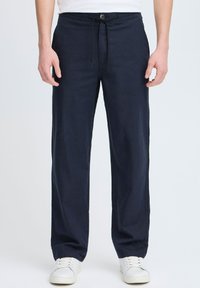 Navy blue lightweight pants with a drawstring waistband, featuring a button closure and straight-leg design, made from a soft fabric.