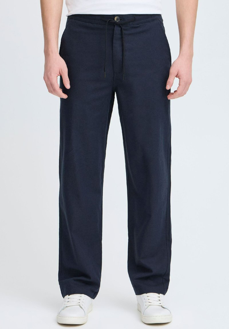 Navy blue lightweight pants with a drawstring waistband, featuring a button closure and straight-leg design, made from a soft fabric.