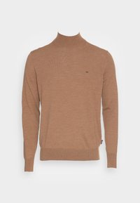 Brun polotröja i mjukt tyg. Har långa ärmar, en åtsittande krage och en liten logotyp på bröstet. Lättviktsdesign.