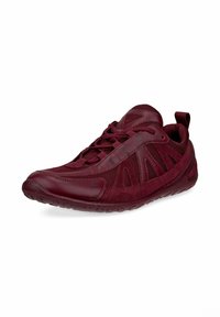 Burgundy athletic shoe with a textured upper, mesh panels, and rubber sole. Features a padded collar and lacing system for secure fit.