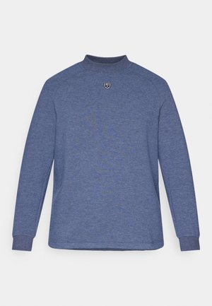 Blue long-sleeved shirt with a high neck, ribbed cuffs, and a small black logo on the chest; features a textured fabric pattern.