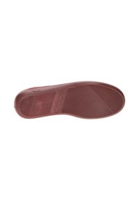 Red rubber shoe sole with textured grip. Features a rounded toe and embossed logo. Pattern includes horizontal and vertical lines for traction.