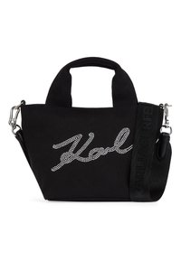 Borsa a mano in tela nera con manici corti, tracolla larga staccabile e testo in corsivo con cristalli sul davanti.