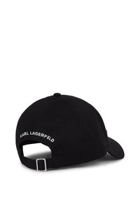 Juodas medvilninis kepurė su išlenktu skydeliu ir reguliuojama juostele gale. "KARL LAGERFELD" yra siuvinėta balta spalva.