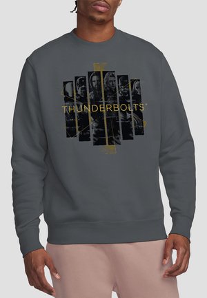 Dunkelgrauer Sweatshirt mit einem goldenen und schwarzen "THUNDERBOLTS"-Grafikdesign, das stilisierte Illustrationen von Charakteren zeigt. Aus einer Baumwollmischung gefertigt.