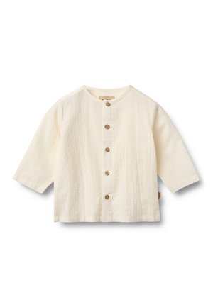 Weißes, strukturiertes Hemd mit rundem Halsausschnitt und dreiviertel Ärmeln. Verfügt über braune Knöpfe an der Vorderseite und ein seitliches Stoffetikett.