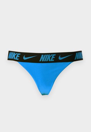 Modré tangá s čiernou páskou v páse, ktorá obsahuje opakujúce sa modré logá Nike a symboly Swoosh.