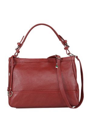 Red leather handbag with two adjustable straps, textured surface, and a small hanging charm with green, white, and red stripes.