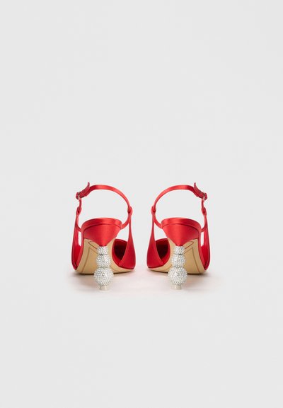 Red satin heeled sandals with a back strap, featuring crystal embellishments on the heels and an open toe design.