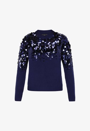 Marineblå sweater med lange ærmer, der har en gradient af store, skinnende sorte og sølvfarvede paljetter i den øverste del. Ribbet halsudskæring og søm.