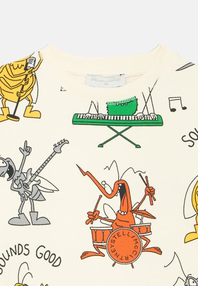 Kremasto obarvana jopa z igrivim risanim potiskom različnih žuželk, ki igrajo inštrumente. Vključuje zelene, rumene in oranžne poudarke.