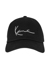 Casquette de baseball noire en coton, avec un logo signature brodé blanc à l'avant. Visière courbée et design à six panneaux.