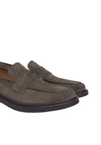 Suede loafers in dark green with a smooth texture. Padded tongue and contrasting stitching. Black rubber sole with slight elevation.