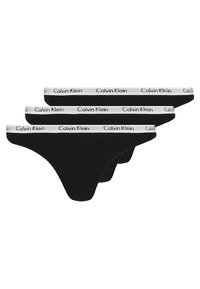 Trois culottes string noires avec des ceintures élastiques blanches, arborant le logo "Calvin Klein". Tissu lisse avec un design à couverture minimale.