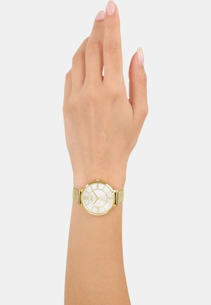 Goldene Armbanduhr mit einem weißen runden Ziffernblatt, strukturiertem goldenen Mesh-Armband und römischen Ziffern als Stundenmarkierungen. Elegantes und schlichtes Design.