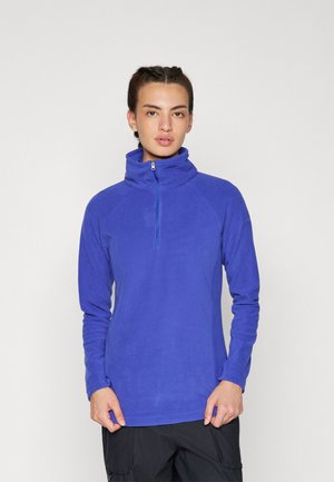 Fioletowy polarowy pulower z wysokim kołnierzem i pół-zamkiem. Posiada długie rękawy i miękką teksturę. Idealny do codziennych stylizacji lub jako warstwa dodatkowa.